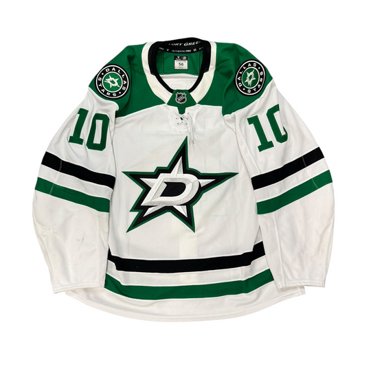 Game Worn Dallas Stars Away jersey with Stars logo on chest and number 10 on the sleeves. Jersey on a white background.