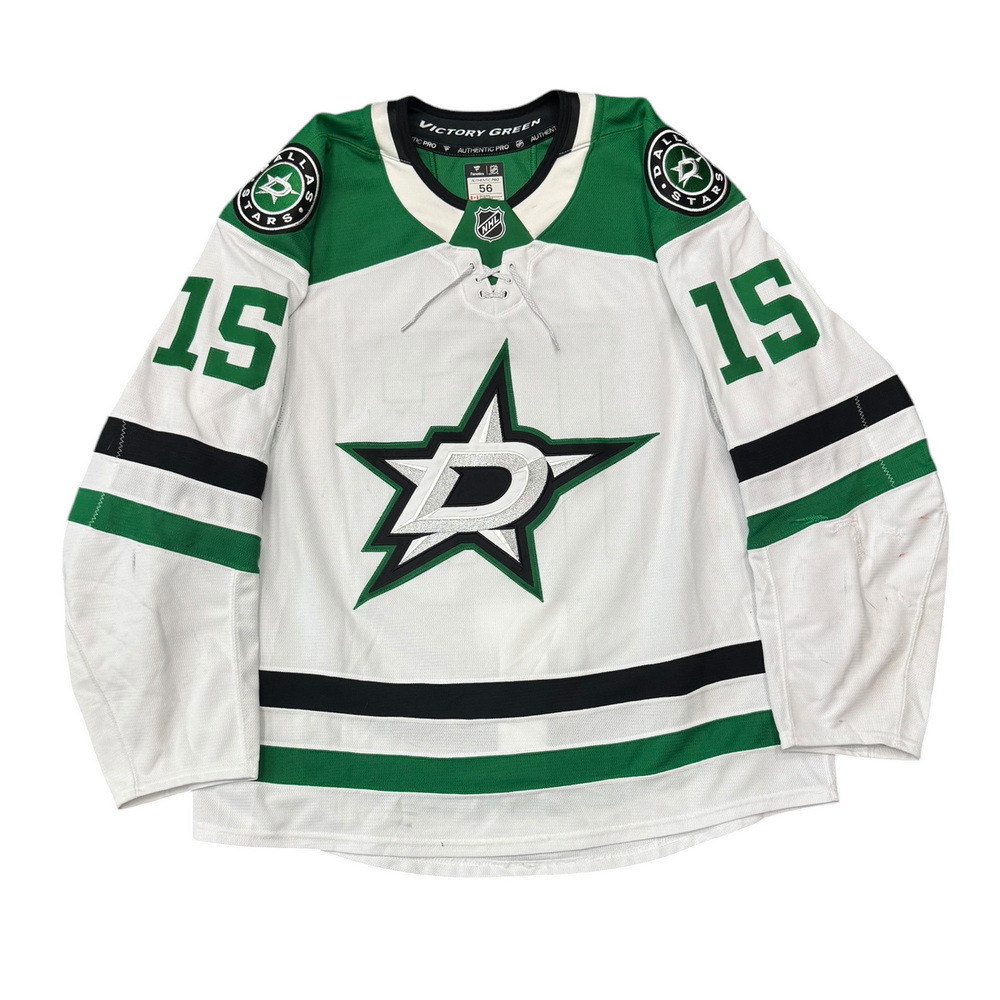 Game Worn Dallas Stars Away jersey with Stars logo on chest and number 15 on the sleeves. Jersey on a white background.