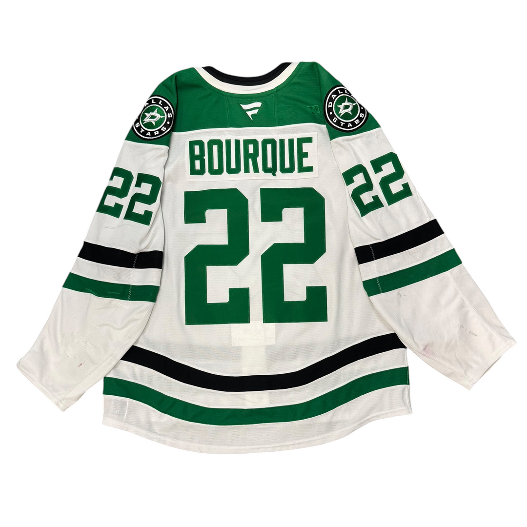 Game worn Dallas Stars away jersey with number 22 and name 'Bourque' on a white background