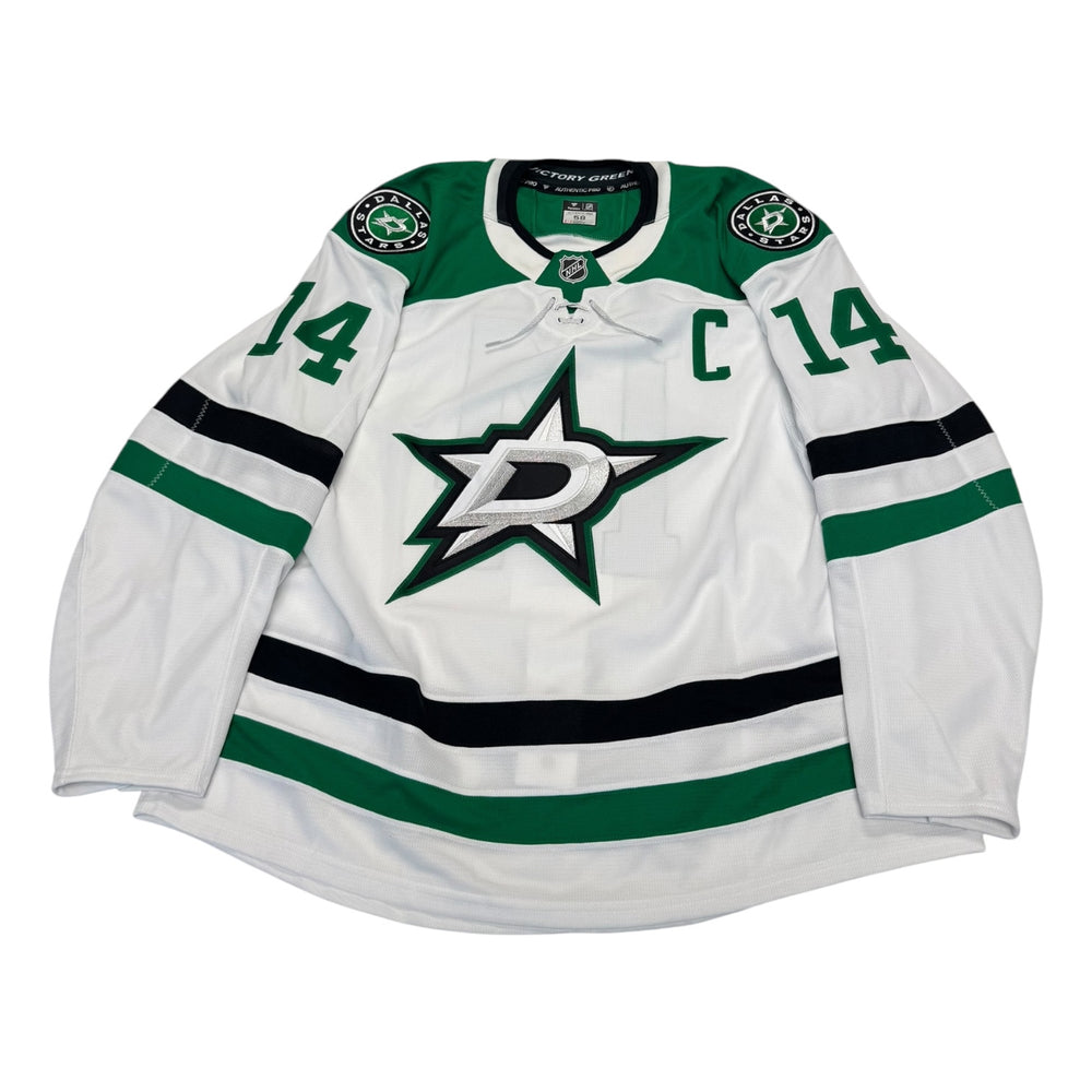 Game worn Dallas Stars Away jersey, number 14 on the sleeves with Dallas Stars logo and "C" on the chest. Hockey jersey on a white background
