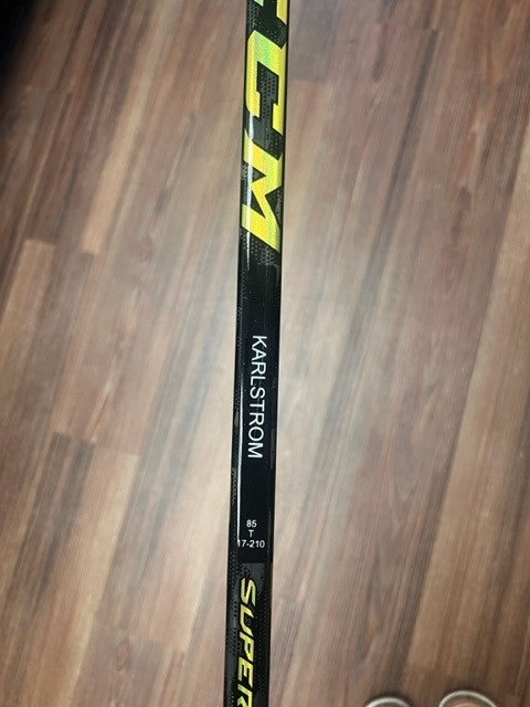 KARLSTROM NEW CCM TEAM ISSUED STICK - View of name on stick