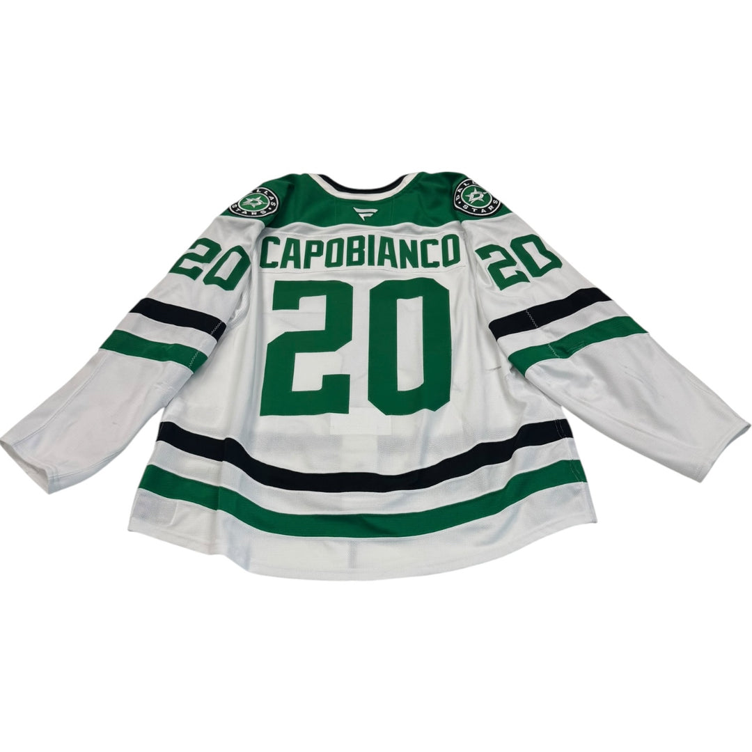 Game worn Dallas Stars away jersey with number 20 and name 'Capobianco'. jersey on a white background