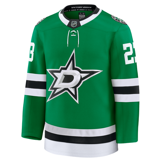 A green Dallas Stars hockey jersey with white and black accents, featuring the team&