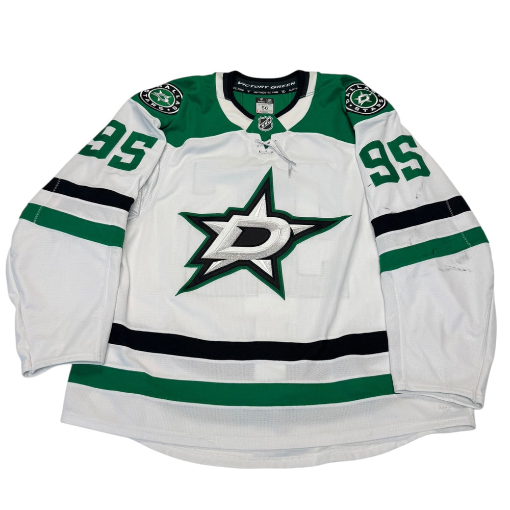 Game worn Dallas Stars Away jersey, number 95 on the sleeves with Dallas Stars logo on the chest. Hockey jersey on a white background