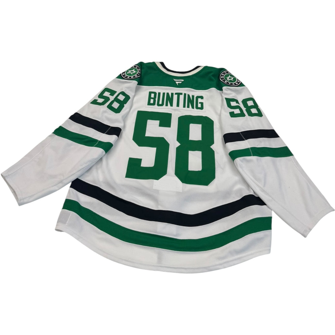 Game worn Dallas Stars away jersey jersey with number 58 and name 'Bunting' on a white background