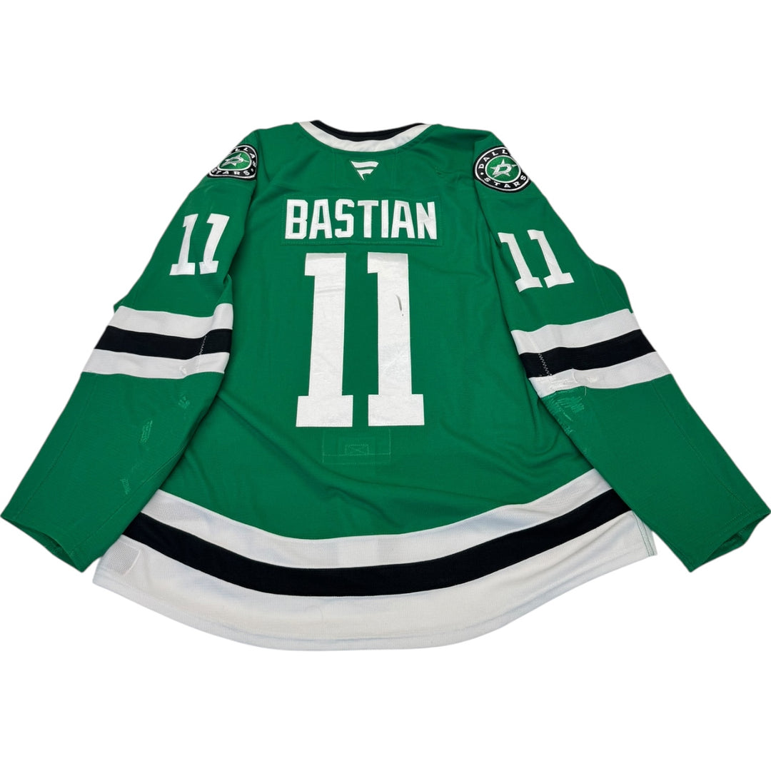 Game Worn Dallas Stars Home hockey jersey with 'Bastian' and number '11' on a white background