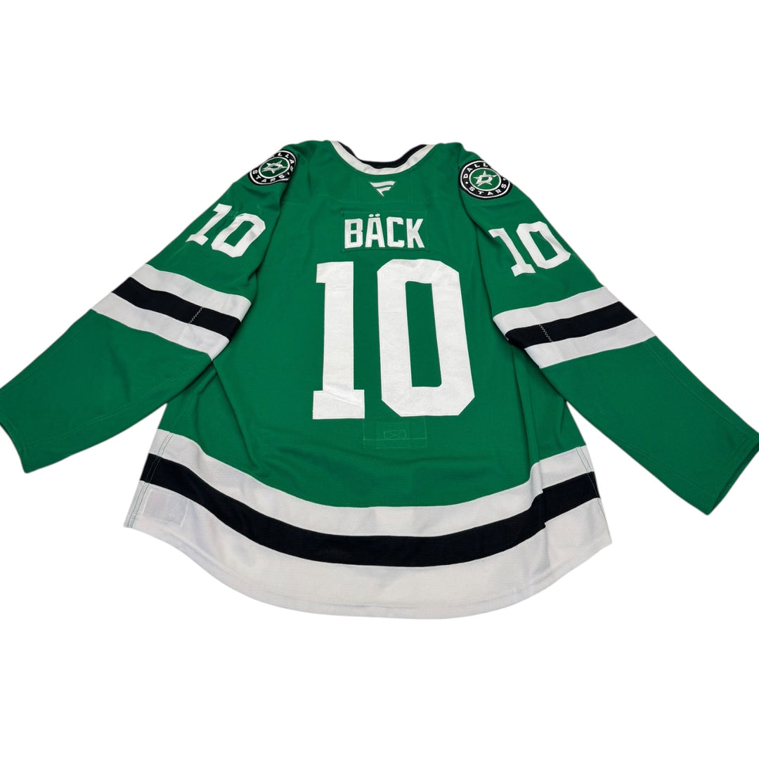Game worn Dallas Stars home hockey jersey with number 10 and name 'Bäck' on a white background