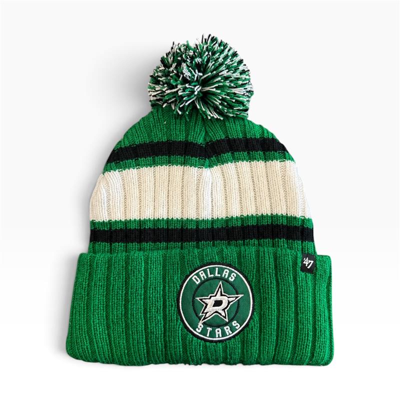 A green and cream striped knit beanie with a pom-pom on top, featuring a Dallas Stars patch on the front cuff and a small &
