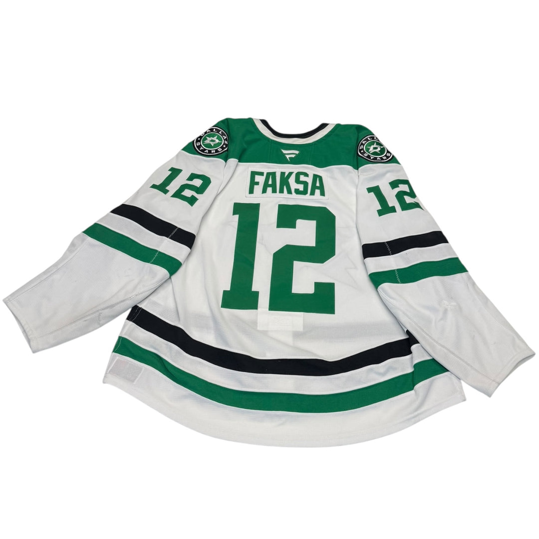 Game worn Dallas Stars away jersey with number 12 and name 'Faksa'. Jersey on a white background