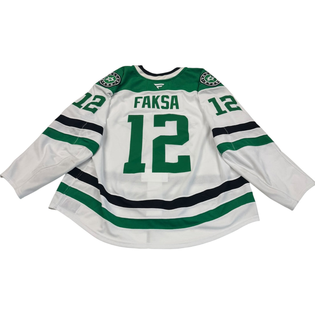Game worn Dallas stars away jersey with number 12 and name 'Faksa'. Jersey on a white background