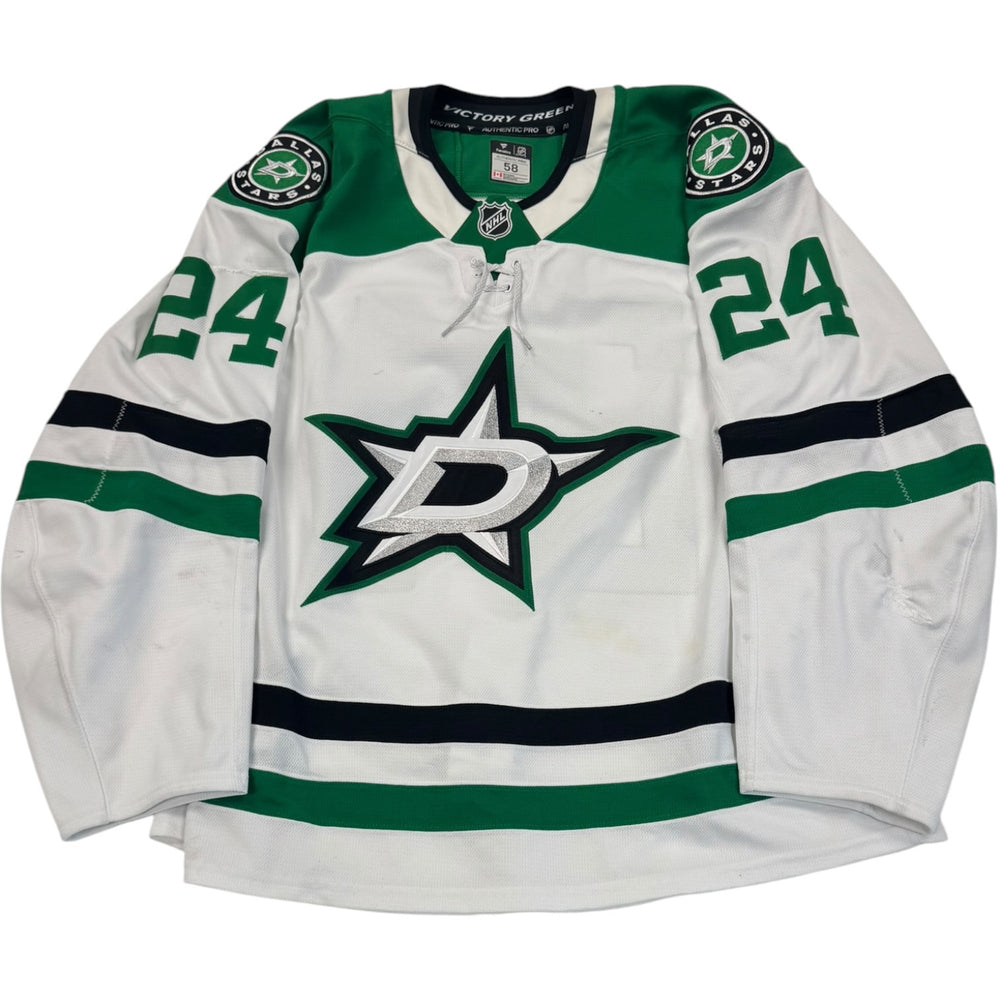 Game worn Dallas Stars Away jersey, number 24 on the sleeves with Dallas Stars logo on the chest. Hockey jersey on a white background

