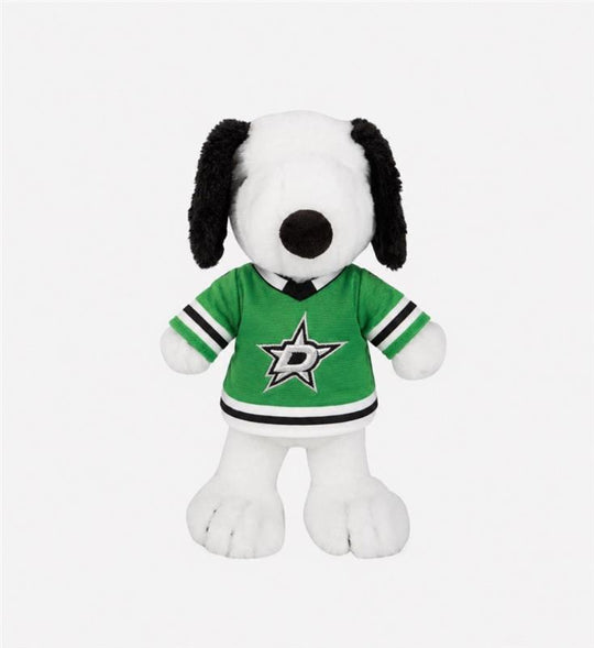 A plush Snoopy doll wearing a green Dallas Stars hockey jersey, set against a plain light gray background.
