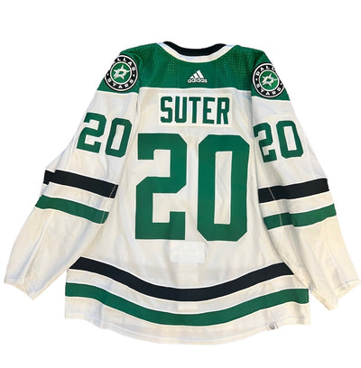 PHOTO OF RYAN SUTER 2023-24 GAME WORN SET 2 AWAY JERSEY - BACK VIEW