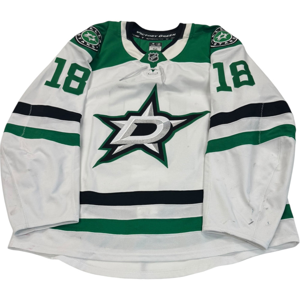 Game worn Dallas Stars Away jersey, number 18 on the sleeves with Dallas Stars logo on the chest. Hockey jersey on a white background
