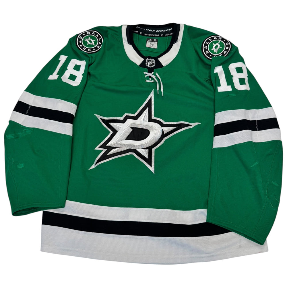 Green hockey jersey with number 18 and team logo on a white background