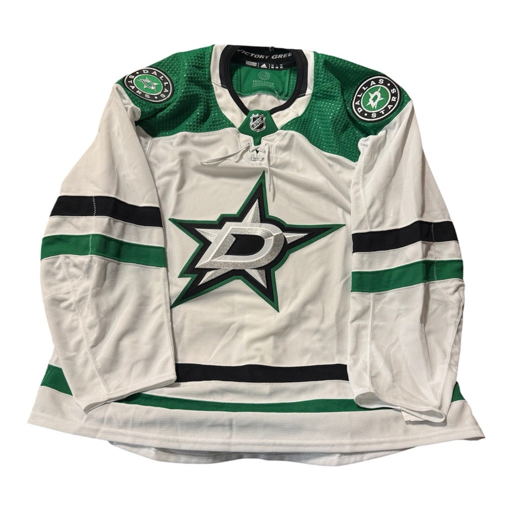 Team issued Away White hockey jersey with Dallas Stars logo. Jersey on a white background