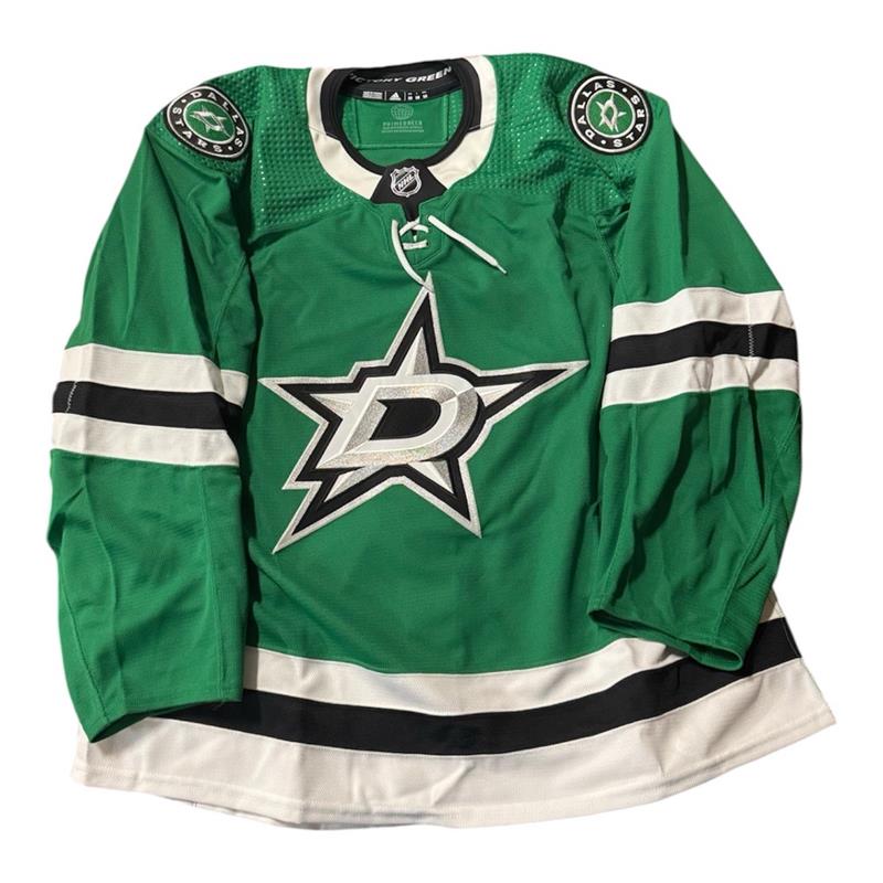 Team issued Home Green hockey jersey with Dallas Stars logo. Jersey on a white background