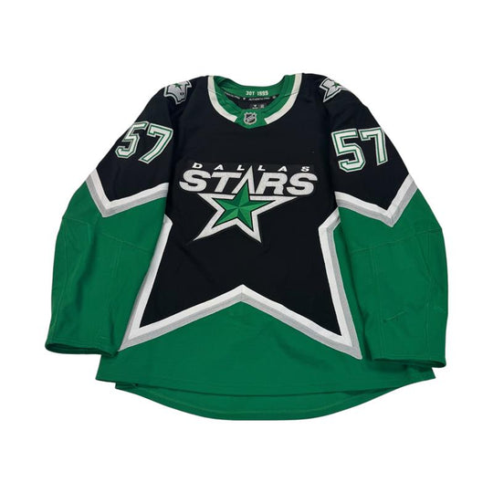 Hockey jersey with Dallas Stars logo and number 57 on Sleeves. Jersey on a white background
