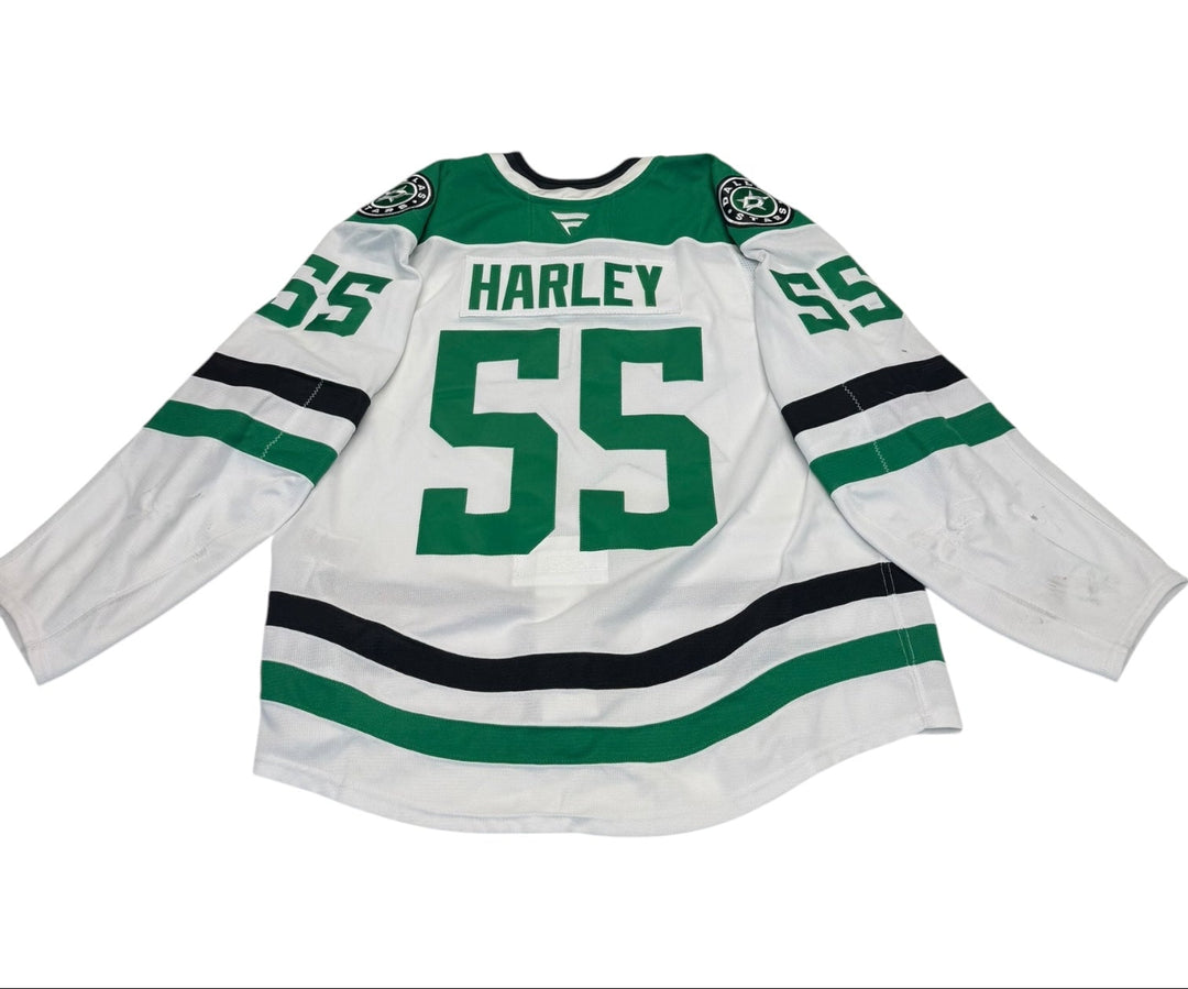 Game worn Dallas Stars away jersey with number 55 and name 'Harley'. jersey on a white background