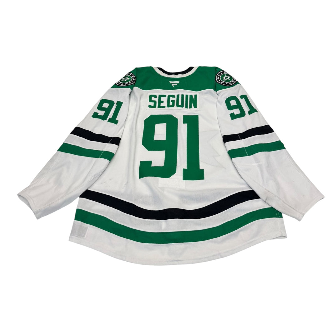 Game worn Dallas Stars away jersey with number 91 and name 'Seguin' on a white background