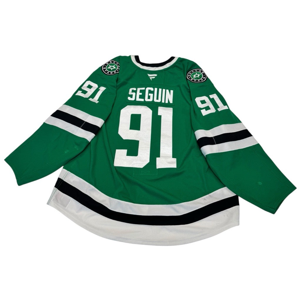 Game worn Dallas Stars Home hockey jersey with number 91 and name 'Seguin' on a white background